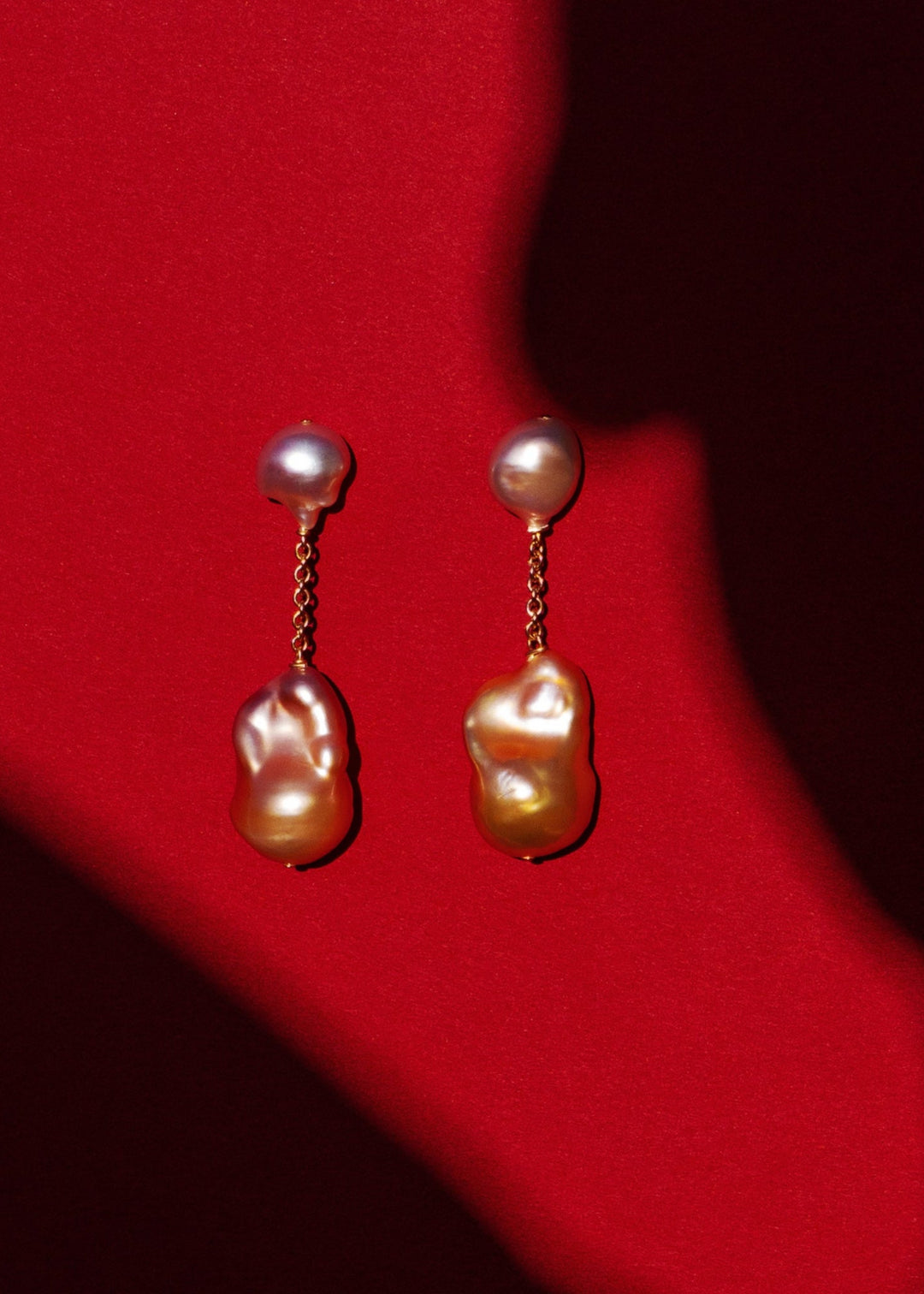 Riviera - Suspended from a delicate round box chain, luminous pink baroque pearls bring a touch of soft sophistication. Their irregular forms catch the light beautifully, celebrating individuality in every detail. 14K Solid Gold Pink Freshwater Baroque Pe
