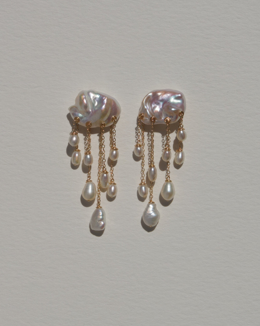 Snowfall earrings, white keshi pearls with cascading gold chains and white pearl drops