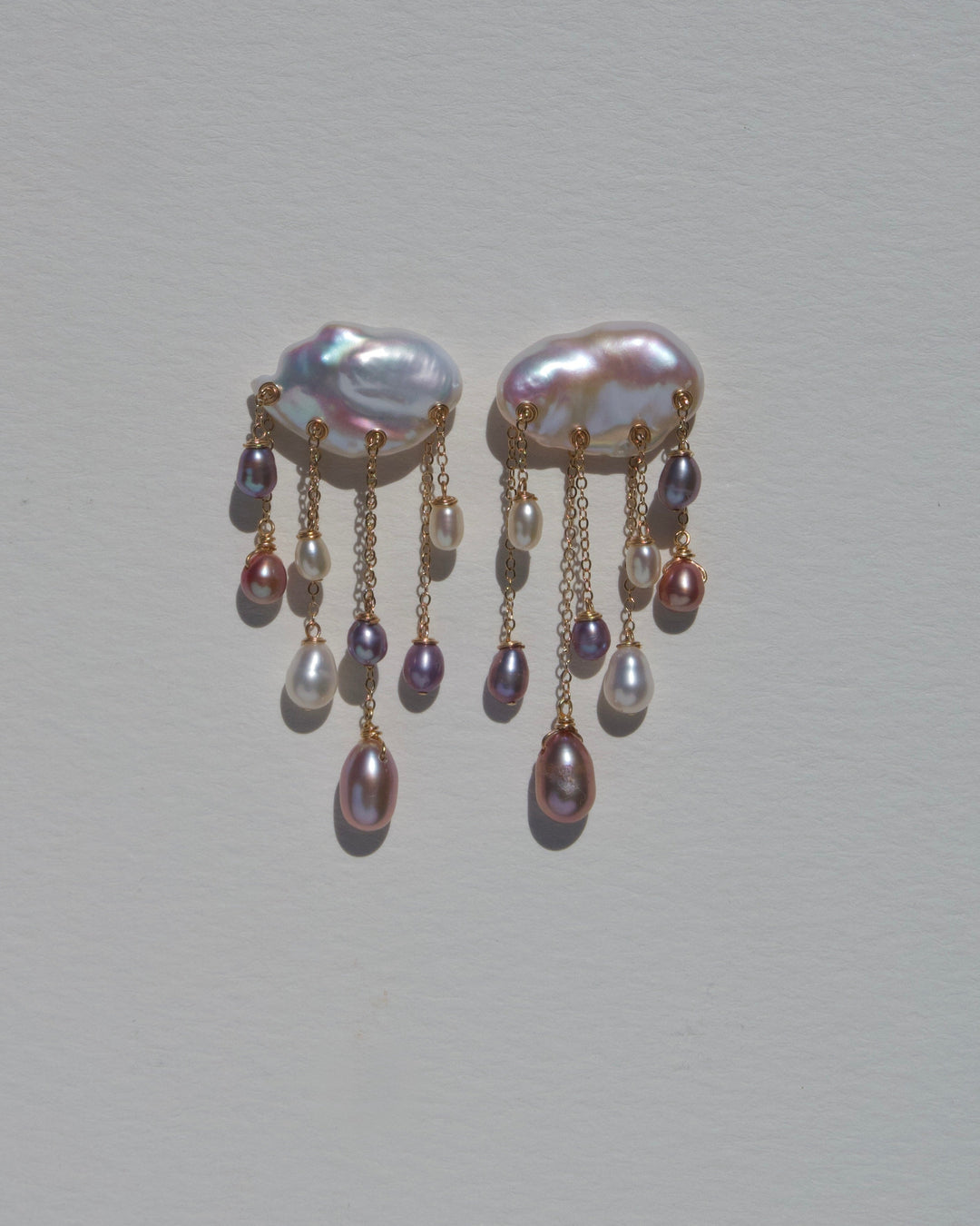 Tempest earrings, keshi pearl clouds with purple, pink, and white pearl raindrops