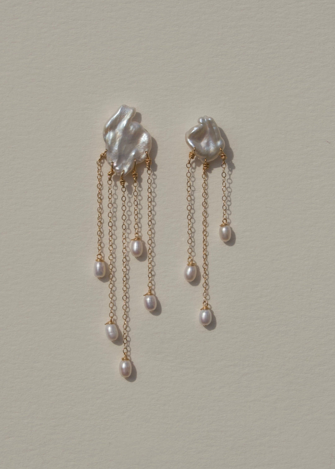 Solid gold earrings with keshi pearls and dangling teardrop pearls