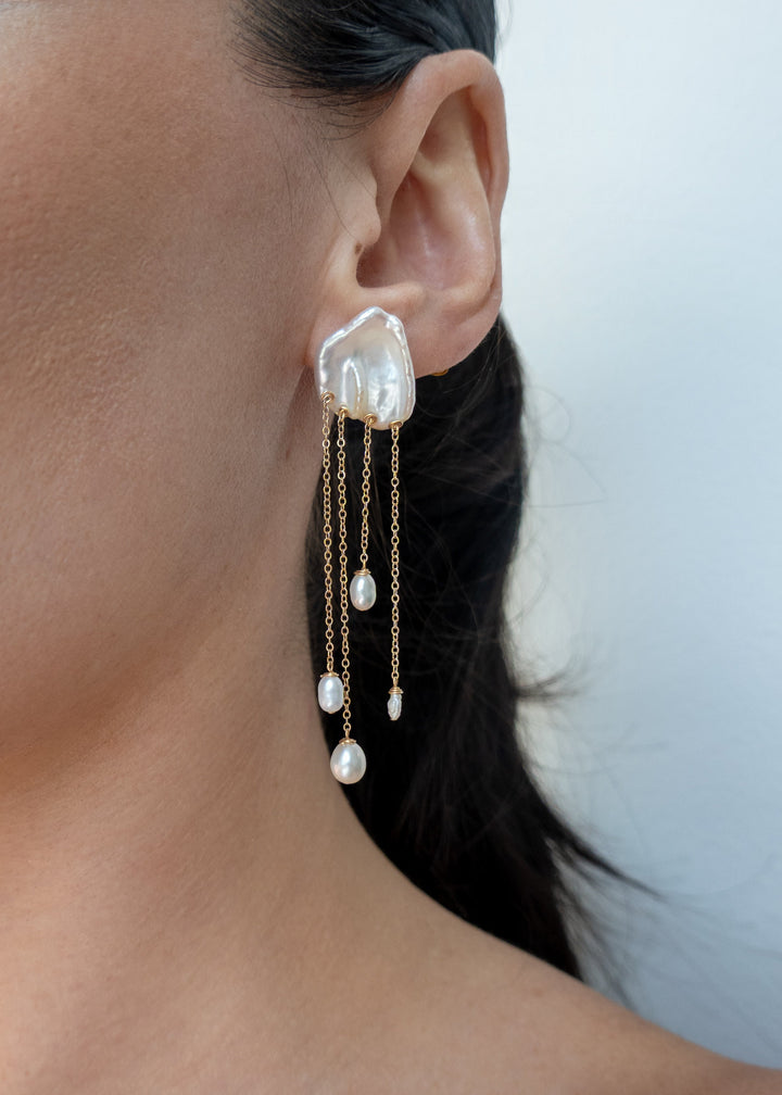 Sierra earrings worn on a model&