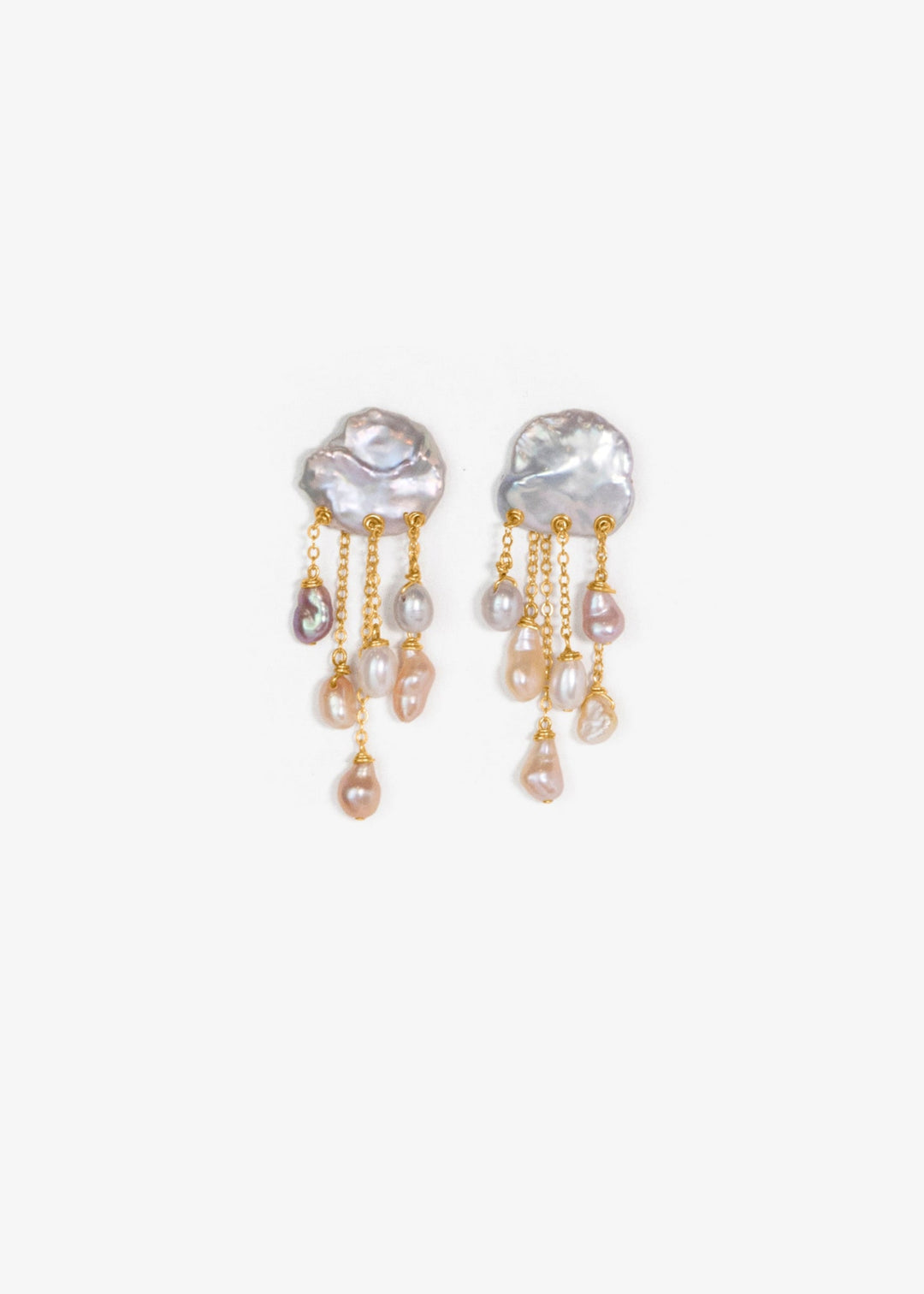 Squall - Like a sudden summer storm, the Squall earrings are full of color, movement, and quiet intensity. At the top sit two blue keshi pearls, moody and iridescent, while twelve pearls in varying tones cascade below. Vivid, sculptural, and softly dramat