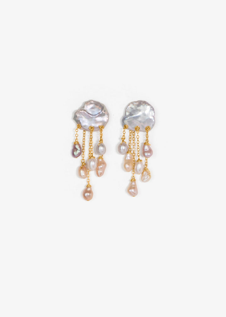 Squall - Like a sudden summer storm, the Squall earrings are full of color, movement, and quiet intensity. At the top sit two blue keshi pearls, moody and iridescent, while twelve pearls in varying tones cascade below. Vivid, sculptural, and softly dramat