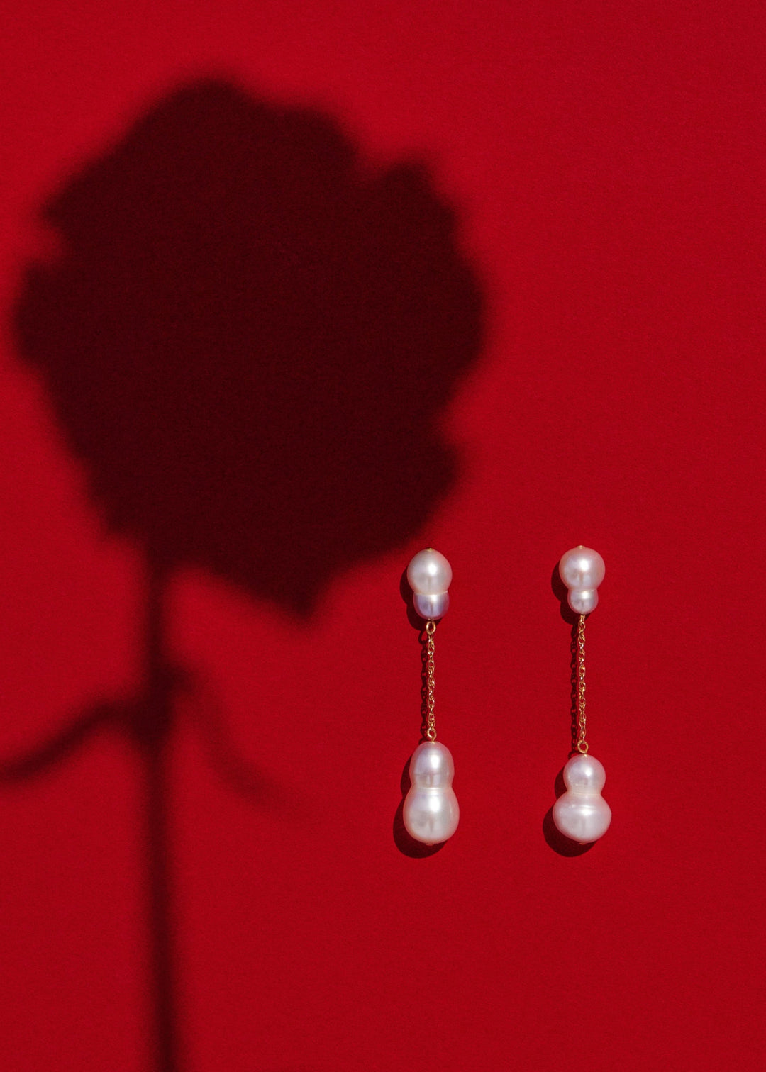 Stella - Suspended from a delicate rope chain, these white and silver baroque pearls bring a touch of soft sophistication. Their irregular forms catch the light beautifully, celebrating individuality in every detail. 14K Solid Gold Freshwater Baroque pear