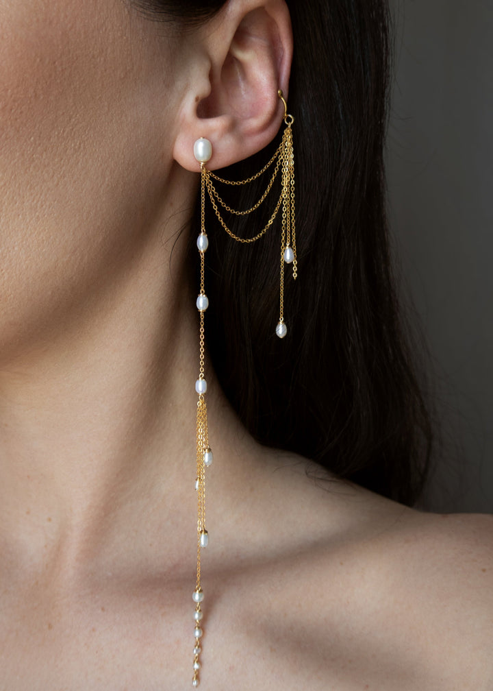 Sueño - Whether you have multiple piercings or just one, these are the earrings you’ve likely dreamed of. Dainty and delicate, yet anything but understated—they sway softly and catch every bit of light. Designed to be worn on either ear, with a cuff versi