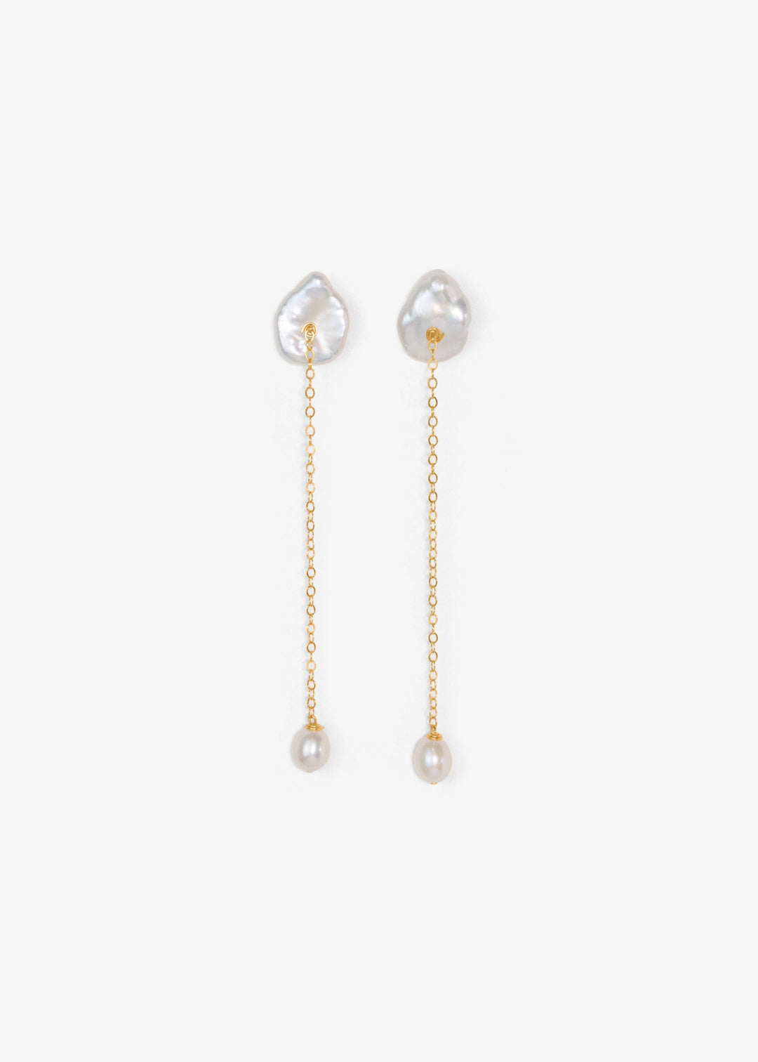 Viv - These earrings feature a single medium sized keshi pearl with a delicate 14k gold chain that falls gracefully below. At the end, a soft teardrop pearl adds a subtle glow and movement. Perfect for those who love something minimal yet distinct, especi