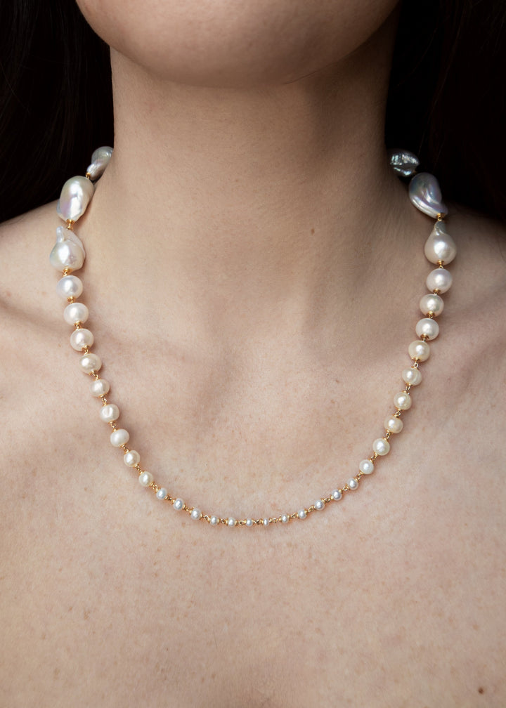 Wren Necklace - A classic baroque pearl necklace — but with a bit more drama. Bold, oversized pearls at the back taper into delicate seed pearls at the front, creating an unexpected silhouette that captivates and intrigues. 14K Gold-Filled Tarnish-Resista