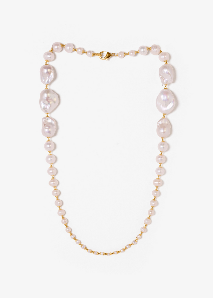 Wren Necklace - A classic baroque pearl necklace — but with a bit more drama. Bold, oversized pearls at the back taper into delicate seed pearls at the front, creating an unexpected silhouette that captivates and intrigues. 14K Gold-Filled Tarnish-Resista