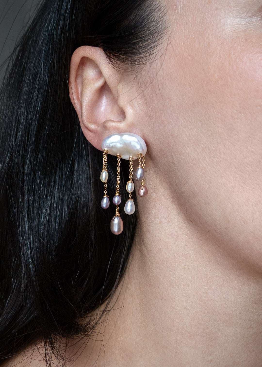 Tempest earrings worn on a model&