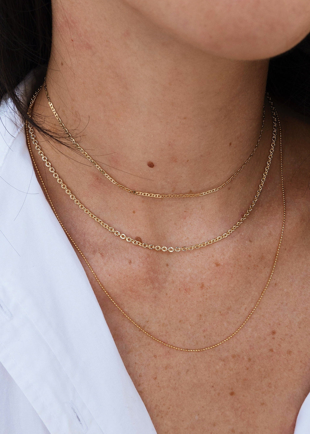 Three layered necklace with three gold-filled chains