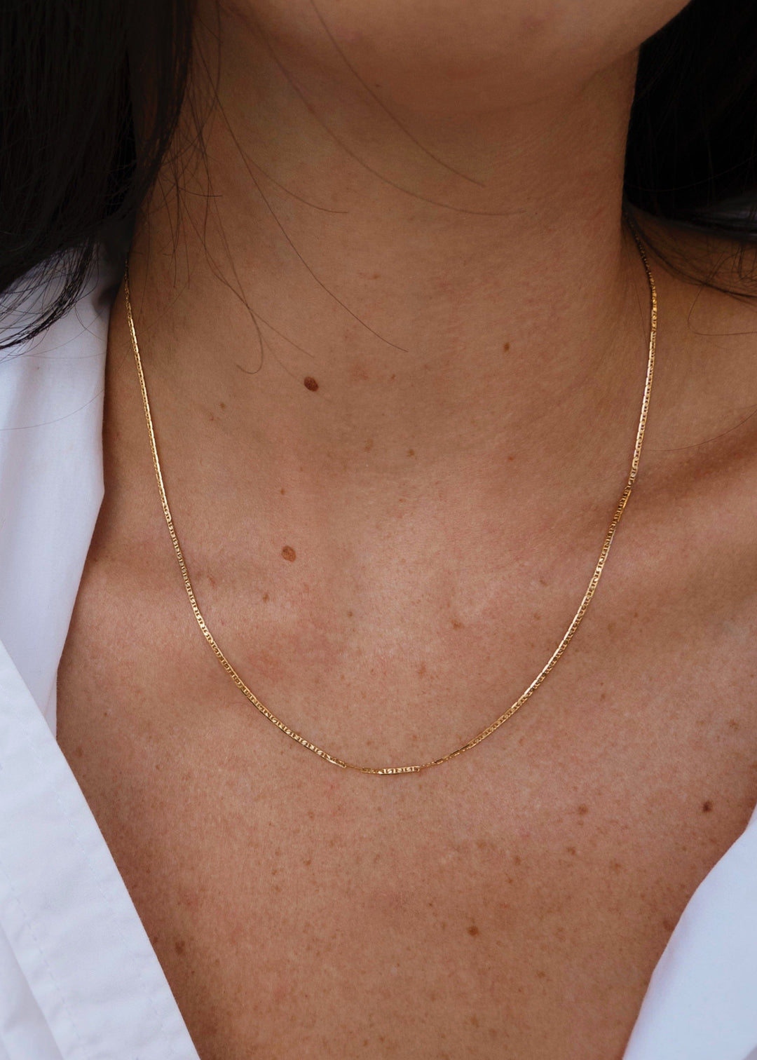 Gold-filled choker on neck