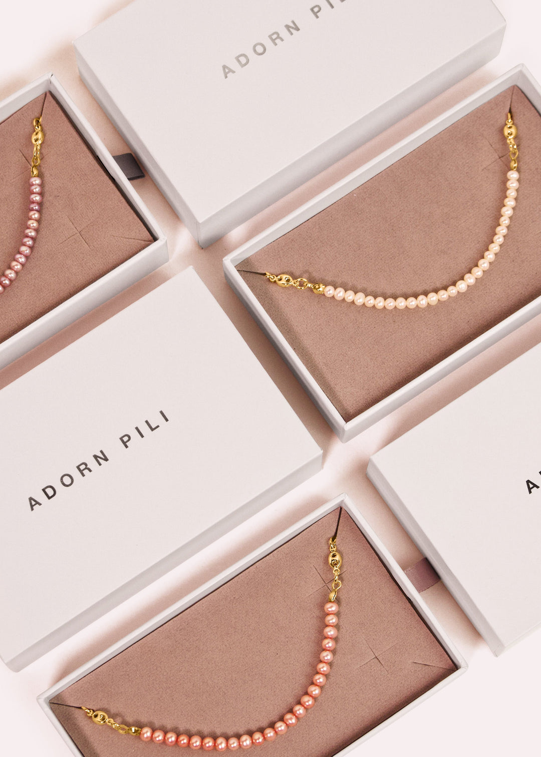 Necklaces with gold-filled chunky chain and lustrous white and pink pearls